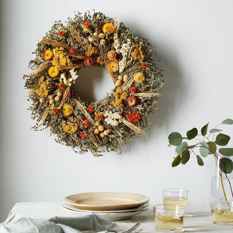 1560869055-fall-door-decor-56434dda-e16a-479f-88d7-fe1cfc7f92c2-2019-0315-creekside-farms-mixed-marigold-wreath-18-inch-1x1-rocky-luten-021-1560869048