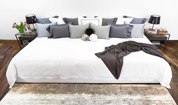 3 Ace-Collection-12-foot-Bed-with-White-Sheet-and-White-and-Gray-Pillows